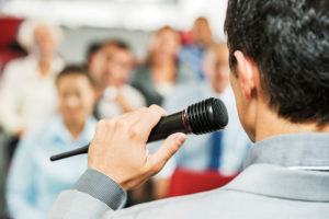 speaker in front of an audience
