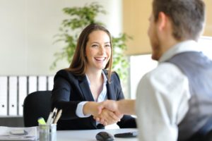 job candidate shaking hand of interviewer